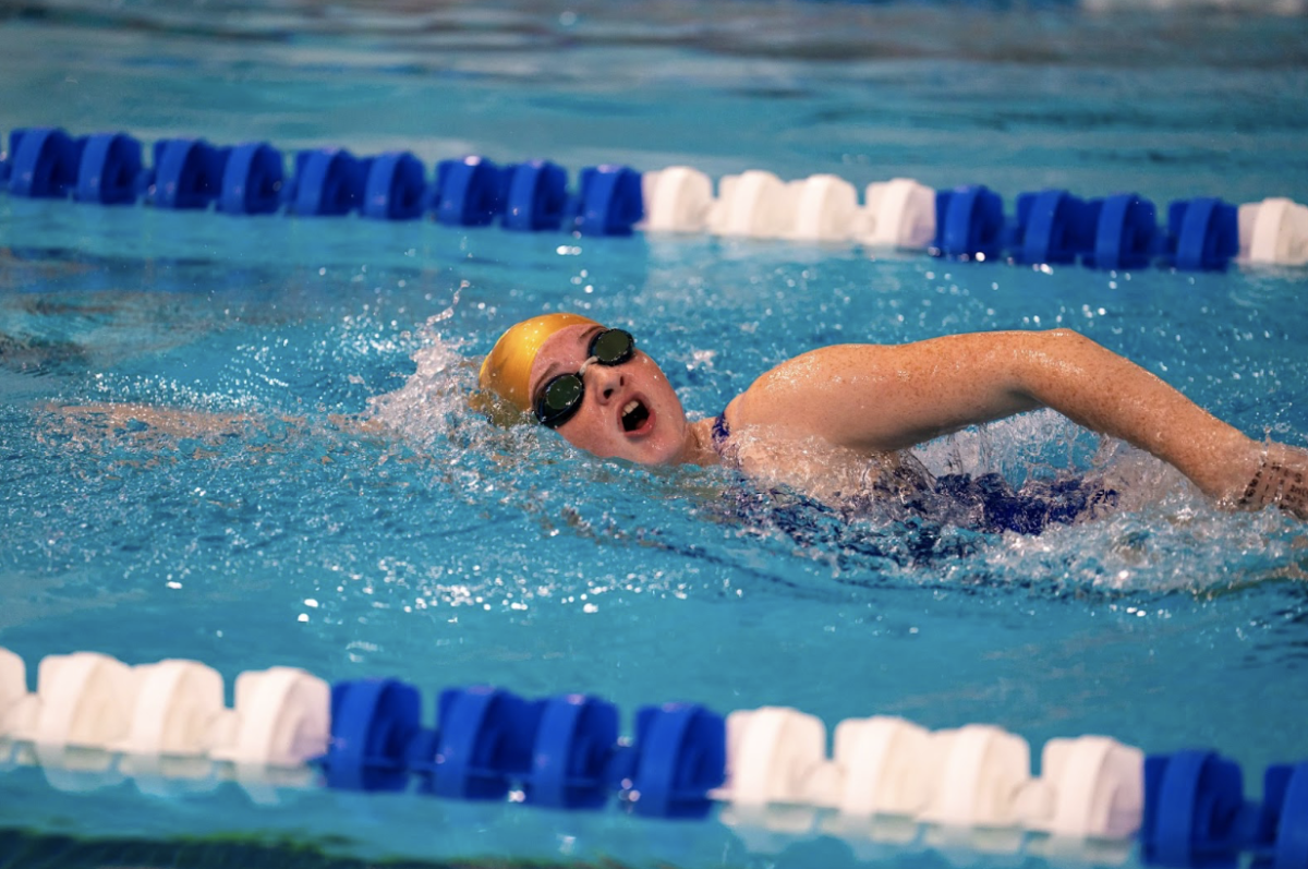 Katie Krull (‘27) swimming in a meet against Tucker High School. Photo courtesy of Cooper Hill (‘25).
